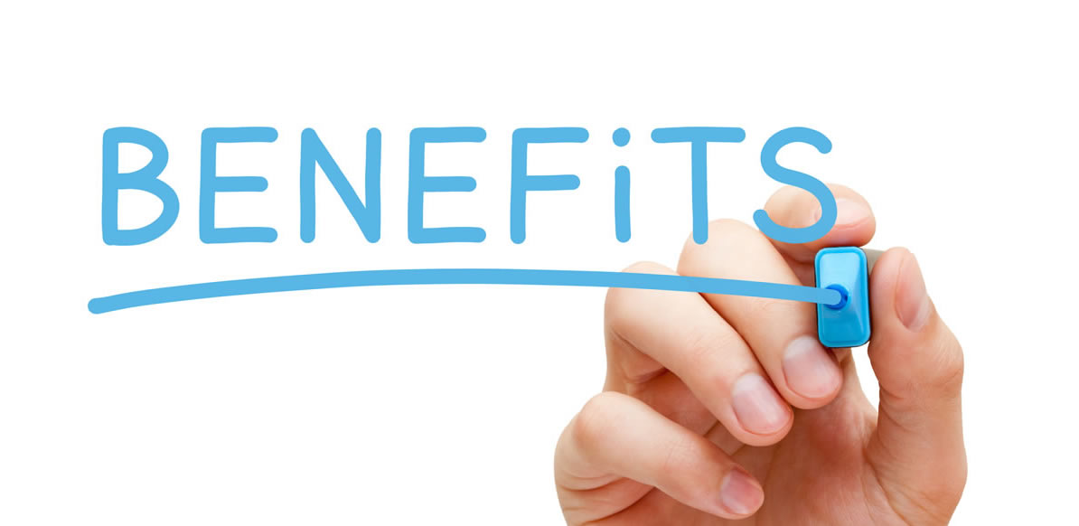 Hand writing the word benefits