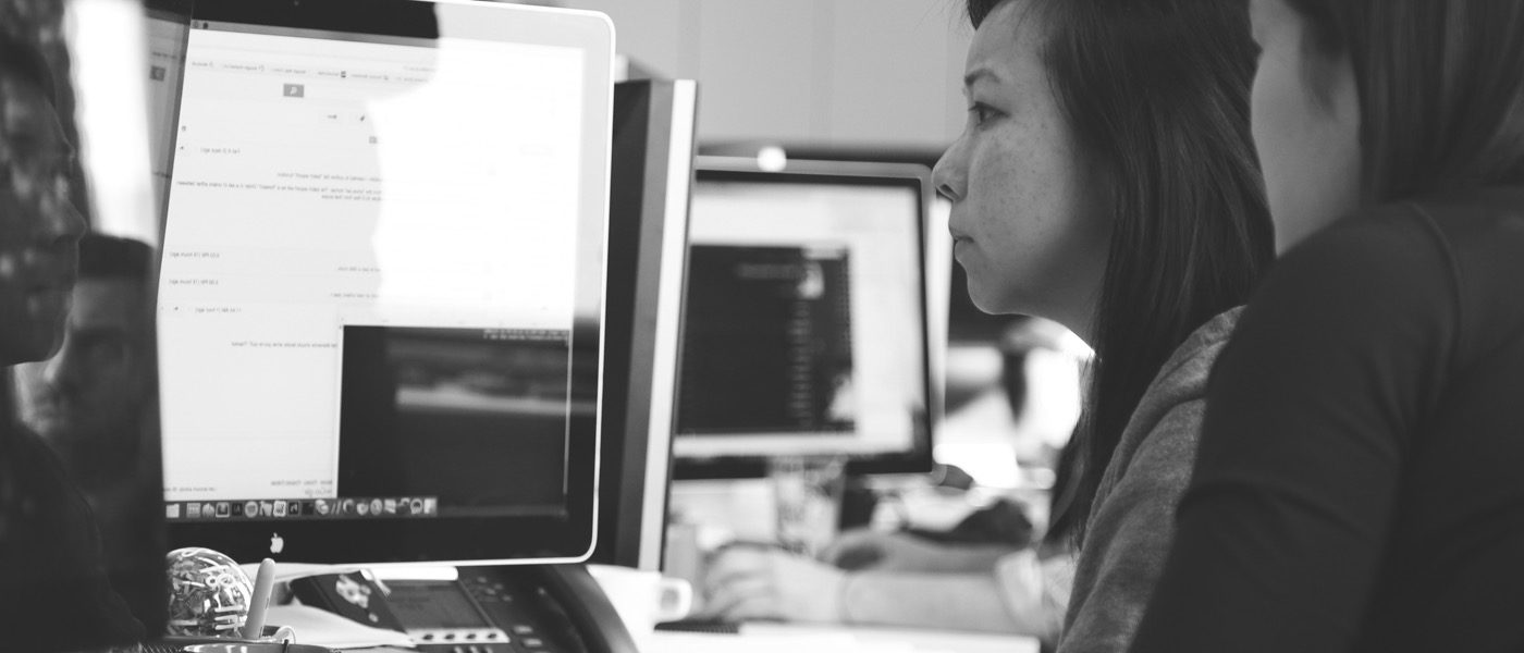 Two female engineers working on a computer workstation