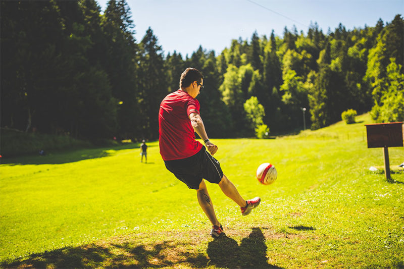 Playing Soccer In Park