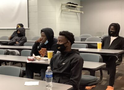 FTCC men's basketball players listen to a lesson during a life skills class