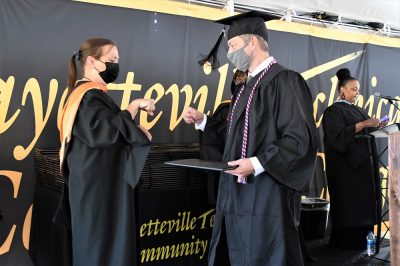 029 Dean Prevatte Fist Bumps A Graduate In Tent C