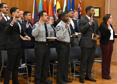Graduates of FTCC's Basic Law Enforcement Training program swear the oath.
