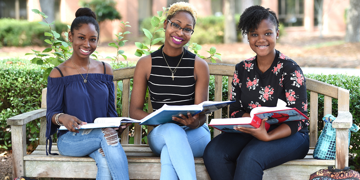 Three FTCC Students Sitting on a Bench