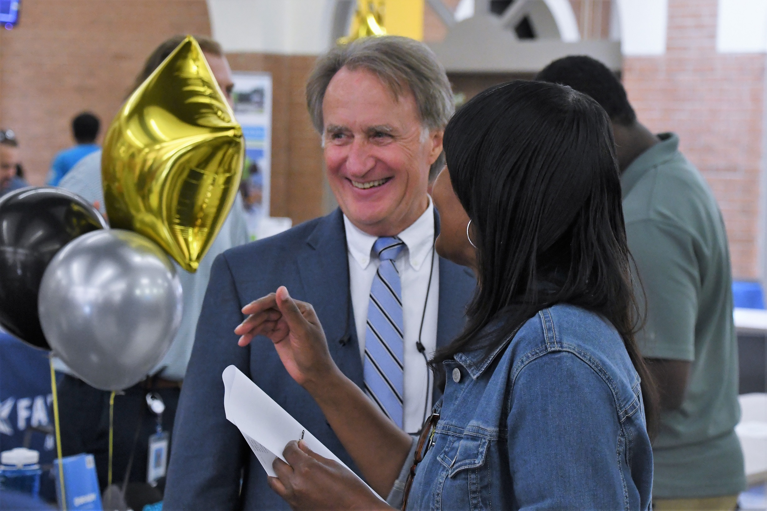 FTCC Vice President Mark Sorrells talks with an attendee at the Expo.