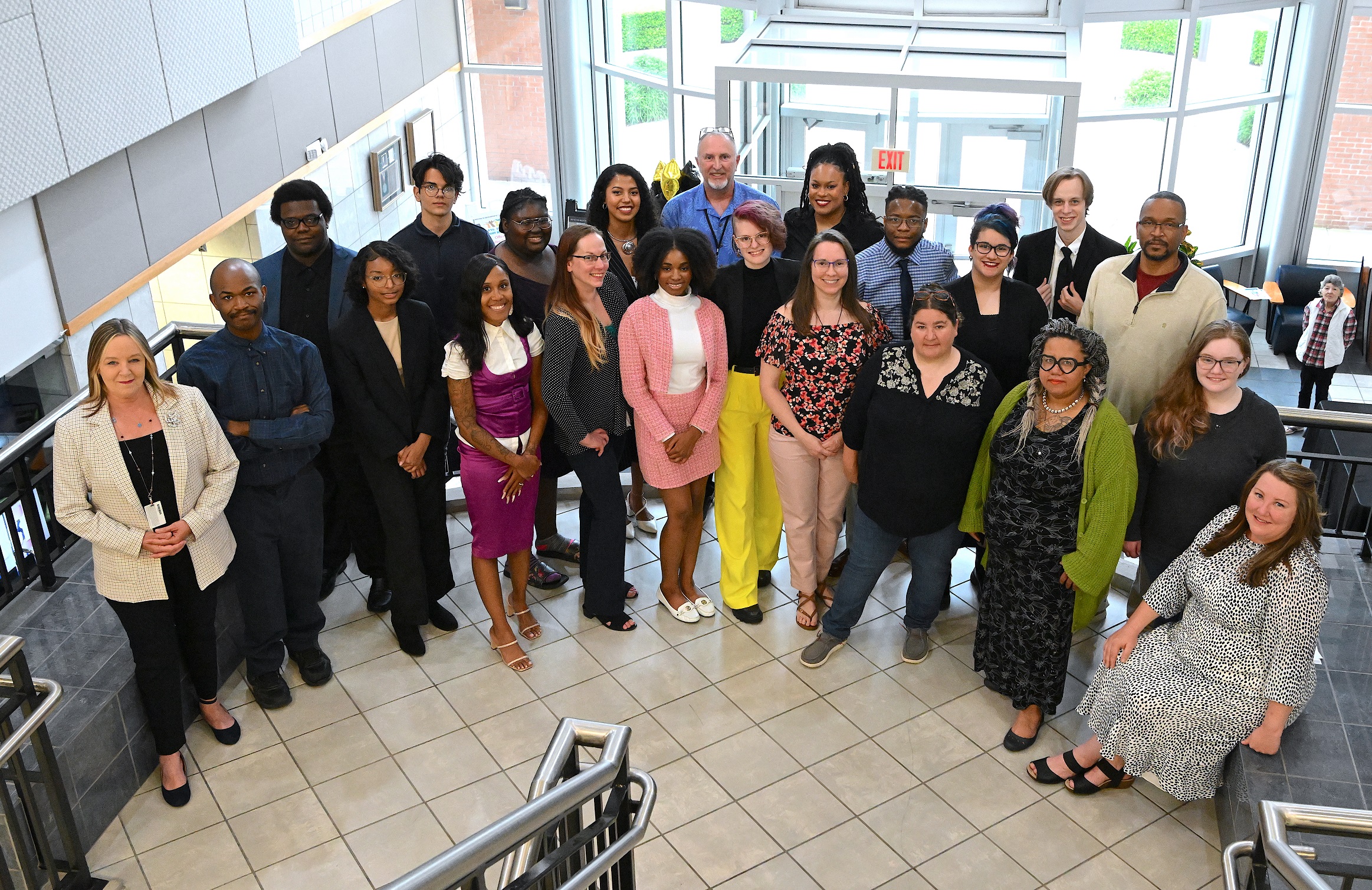 2023 Graduates of FTCC's Advertising & Graphic Design and Digital Media Technology programs pose for a group photo in the lobby of the Virtual College Center.