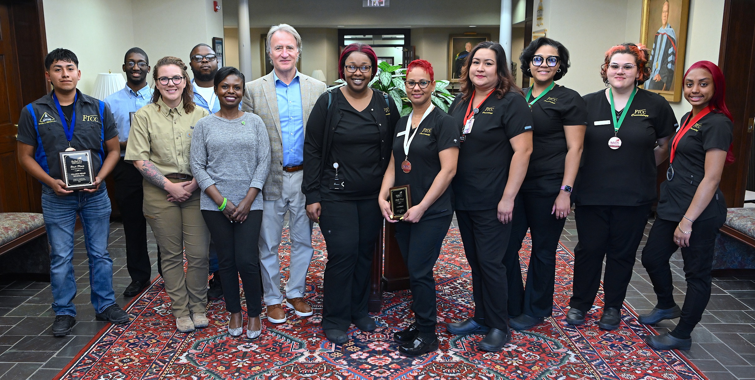 FTCC students who medaled at the SkillsUSA North Carolina 2023 state competition stand with FTCC President Dr. Mark Sorrells.